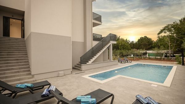 Modern apartment Lacrima 1 with breakfast in villa with a pool on Krk.